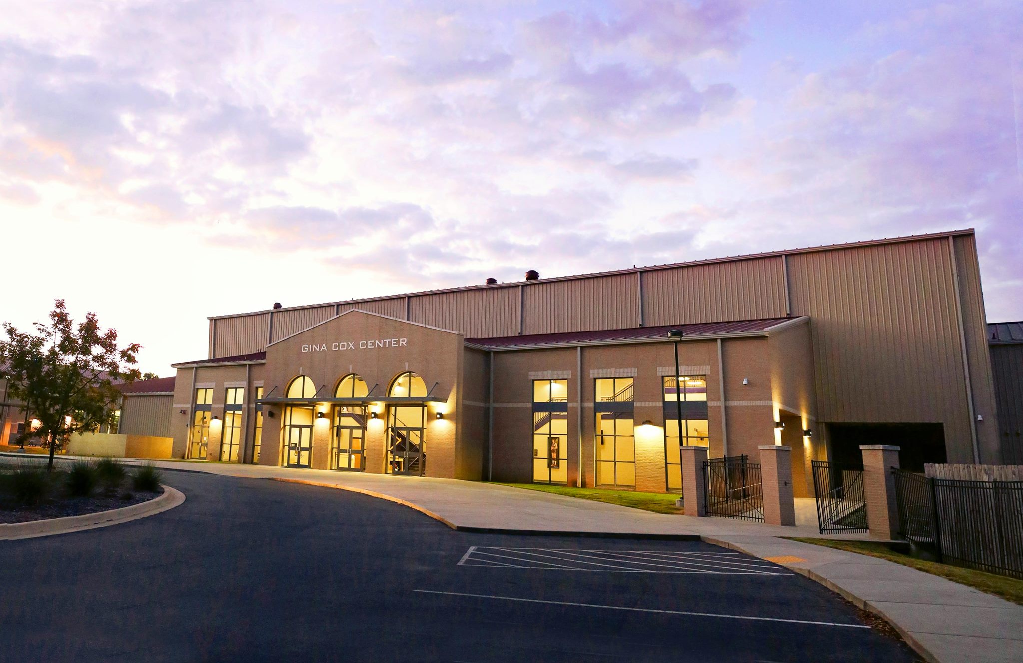 Exterior of Gina Cox center at sunset